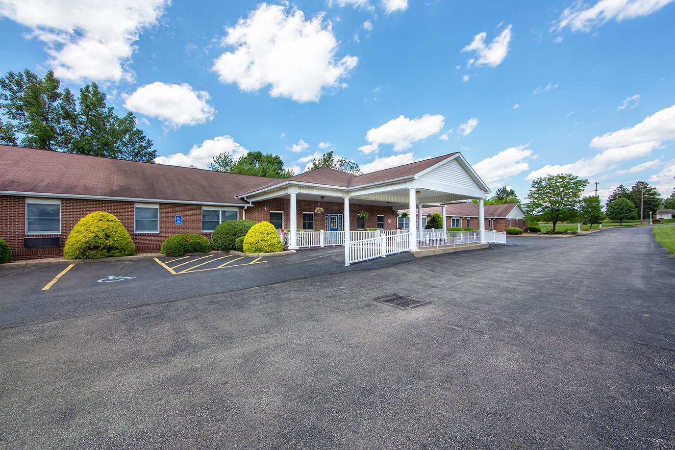 Brick exterior and covered entrance at Gracewoods Senior Living