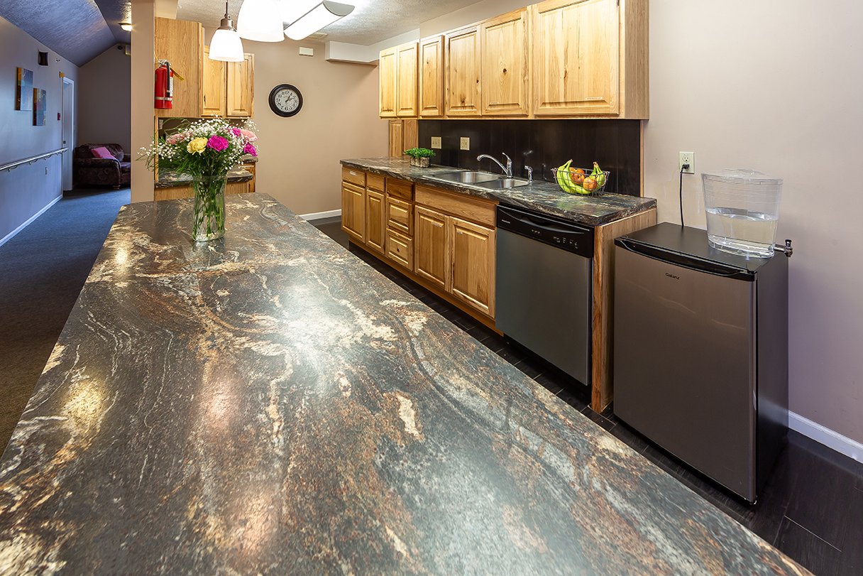 Community kitchenette with granite counters